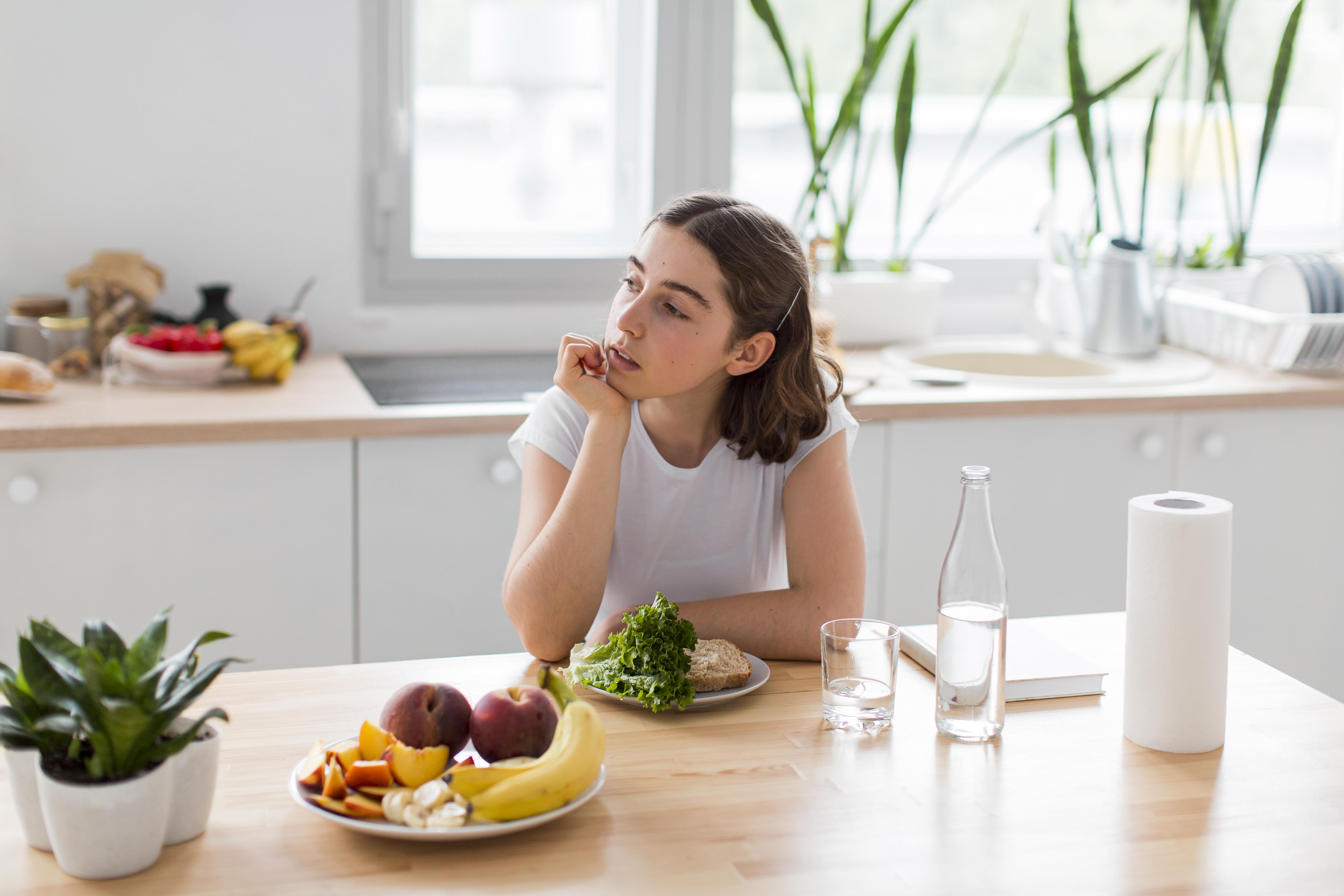 young-woman-relaxing-kitchen